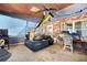 Relaxing patio features a ceiling fan, brick accent wall, and ample space for seating and leisure at 6250 Graceland Cir, Morrow, GA 30260