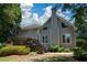 Spacious two-story home featuring a wooden deck, well manicured lawn, and lush landscaping at 1464 Chatsworth Trace, Lawrenceville, GA 30044