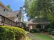 Backyard with a brick building in the distance at 1464 Chatsworth Trace, Lawrenceville, GA 30044