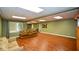 Expansive basement area with laminate floors, recessed lighting, and ample space for entertaining at 1464 Chatsworth Trace, Lawrenceville, GA 30044