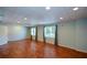 Spacious basement features laminate flooring, recessed lighting, and two bright, natural light-filled windows at 1464 Chatsworth Trace, Lawrenceville, GA 30044