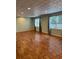 Open basement area with wood floors, drop ceiling, and natural light at 1464 Chatsworth Trace, Lawrenceville, GA 30044