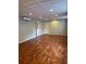 Finished basement with wood floors, drop ceiling, door and mini-split at 1464 Chatsworth Trace, Lawrenceville, GA 30044