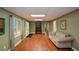 Beautifully finished basement with wood-look floors, recessed lighting, and comfortable seating at 1464 Chatsworth Trace, Lawrenceville, GA 30044