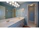 Spacious bathroom boasting a double vanity, large mirror, and tile floors at 1464 Chatsworth Trace, Lawrenceville, GA 30044