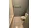 Bathroom features a tile floor, tiled walls, and standard white toilet at 1464 Chatsworth Trace, Lawrenceville, GA 30044