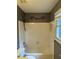 Bathroom featuring a vanity, toilet, tub/shower with tile surround, and a window for natural light at 1464 Chatsworth Trace, Lawrenceville, GA 30044