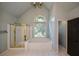 Bathroom with a tub, a window, and a glass-door shower, exuding a spa-like ambiance at 1464 Chatsworth Trace, Lawrenceville, GA 30044