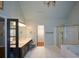 Bathroom featuring a double vanity with dark cabinets, a glass-enclosed shower and tile flooring at 1464 Chatsworth Trace, Lawrenceville, GA 30044