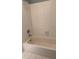 Bathroom features tiled walls and standard bathtub at 1464 Chatsworth Trace, Lawrenceville, GA 30044