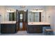 Bright bathroom with double vanity, mirrors, and glass shower enclosure, providing a luxurious feel at 1464 Chatsworth Trace, Lawrenceville, GA 30044