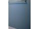 Shot of the light blue painted bathroom wall with a towel rack and tiled floor at 1464 Chatsworth Trace, Lawrenceville, GA 30044