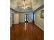 This bedroom provides tray ceilings and double doors to the exterior at 1464 Chatsworth Trace, Lawrenceville, GA 30044