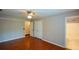Bedroom featuring hardwood floors with a large closet and an adjoining bathroom at 1464 Chatsworth Trace, Lawrenceville, GA 30044