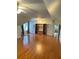 Spacious bonus room includes ceiling fans and built-in shelving at 1464 Chatsworth Trace, Lawrenceville, GA 30044