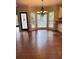 Elegant dining area features hardwood floors and a modern chandelier fixture at 1464 Chatsworth Trace, Lawrenceville, GA 30044
