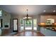 Dining area with chandelier, bay window and view into open space at 1464 Chatsworth Trace, Lawrenceville, GA 30044