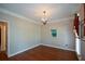 Formal dining room with hardwood floors, chandelier, and neutral paint color at 1464 Chatsworth Trace, Lawrenceville, GA 30044