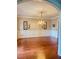 Formal dining room with hardwood floors, wainscoting, and a chandelier at 1464 Chatsworth Trace, Lawrenceville, GA 30044
