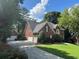 A spacious home with a three-car garage and a long driveway at 1464 Chatsworth Trace, Lawrenceville, GA 30044