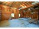 Spacious garage with wood paneling and stairs leading to upper level at 1464 Chatsworth Trace, Lawrenceville, GA 30044
