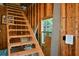 Stairway in garage leads to second level with a window at 1464 Chatsworth Trace, Lawrenceville, GA 30044