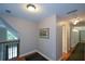 Upstairs hallway with wood floors leading to the bedrooms at 1464 Chatsworth Trace, Lawrenceville, GA 30044