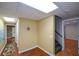 Hallway with access to several rooms and staircase at 1464 Chatsworth Trace, Lawrenceville, GA 30044