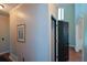 Hallway view featuring a doorway and painting hung on the wall at 1464 Chatsworth Trace, Lawrenceville, GA 30044
