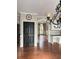 Open-concept living area showcasing hardwood floors, arched doorways, built-in desk and storage, and neutral wall colors at 1464 Chatsworth Trace, Lawrenceville, GA 30044