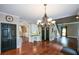 Spacious living room with fireplace, hardwood floors, and ample natural light from large windows at 1464 Chatsworth Trace, Lawrenceville, GA 30044