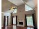 Bright living room with fireplace, large windows, and stylish curtains at 1464 Chatsworth Trace, Lawrenceville, GA 30044