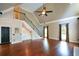 Bright living room with hardwood floors, tall ceilings, and staircase to the upper level at 1464 Chatsworth Trace, Lawrenceville, GA 30044