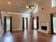 Open living area showcasing a fireplace and numerous windows with coverings at 1464 Chatsworth Trace, Lawrenceville, GA 30044