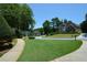 Neighborhood street view showcasing well-manicured lawns, mature trees, and beautiful houses at 1464 Chatsworth Trace, Lawrenceville, GA 30044