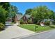 Neighborhood street view showcasing well-manicured lawns, mature trees, and beautiful houses at 1464 Chatsworth Trace, Lawrenceville, GA 30044