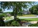 Neighborhood street view showcasing well-manicured lawns, mature trees, and beautiful houses at 1464 Chatsworth Trace, Lawrenceville, GA 30044