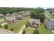Neighborhood view showing a well-maintained lawn and beautiful landscaping at 162 Aylesbury Blvd, Mcdonough, GA 30252