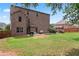 The backyard features a large lawn and mature trees, offering privacy and shade at 162 Aylesbury Blvd, Mcdonough, GA 30252