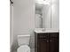 Bathroom featuring a modern vanity, large mirror and toilet at 162 Aylesbury Blvd, Mcdonough, GA 30252