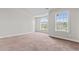 Bedroom featuring a large arched window letting in natural light plus a regular window at 162 Aylesbury Blvd, Mcdonough, GA 30252