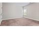 Neutral carpeted room with a double hung window at 162 Aylesbury Blvd, Mcdonough, GA 30252