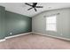 Spacious bedroom with a ceiling fan and plenty of natural light coming through the window at 162 Aylesbury Blvd, Mcdonough, GA 30252