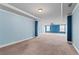 Open floorplan spacious bedroom with blue accent walls and a recessed ceiling at 162 Aylesbury Blvd, Mcdonough, GA 30252