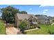 Beautiful two-story brick home features a landscaped front yard, driveway with a basketball hoop, and a well-maintained lawn at 162 Aylesbury Blvd, Mcdonough, GA 30252