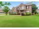 Charming brick two-story home with a well-manicured lawn and inviting curb appeal at 162 Aylesbury Blvd, Mcdonough, GA 30252