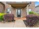 Inviting front porch with decorative shrubbery at 162 Aylesbury Blvd, Mcdonough, GA 30252
