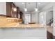 Open-concept kitchen with stainless steel appliances, granite countertops, and pendant lighting at 162 Aylesbury Blvd, Mcdonough, GA 30252