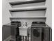 Laundry room features modern washer, dryer, sink and open shelving at 162 Aylesbury Blvd, Mcdonough, GA 30252