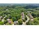 Neighborhood aerial view showing many houses and green tree canopies creating a serene living environment at 5511 Highland Preserve Dr, Mableton, GA 30126